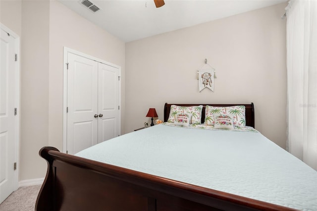 3837 Carrick Bend Dr, Kissimmee, FL 34746 - bedroom with light carpet, a closet, and a ceiling fan