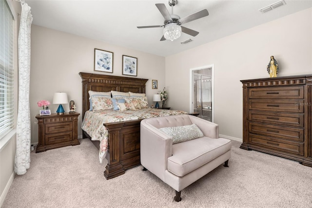3837 Carrick Bend Dr, Kissimmee, FL 34746 - bedroom featuring light carpet, ceiling fan, and ensuite bathroom