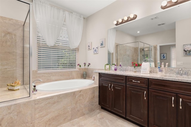 3837 Carrick Bend Dr, Kissimmee, FL 34746 - full bath with a shower stall, double vanity, and a garden tub