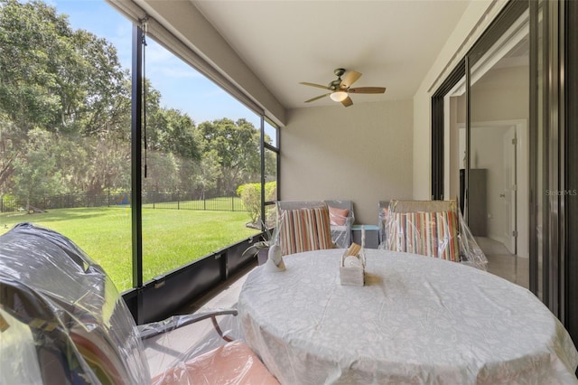 3837 Carrick Bend Dr, Kissimmee, FL 34746 - sunroom / solarium with ceiling fan and view of scattered trees