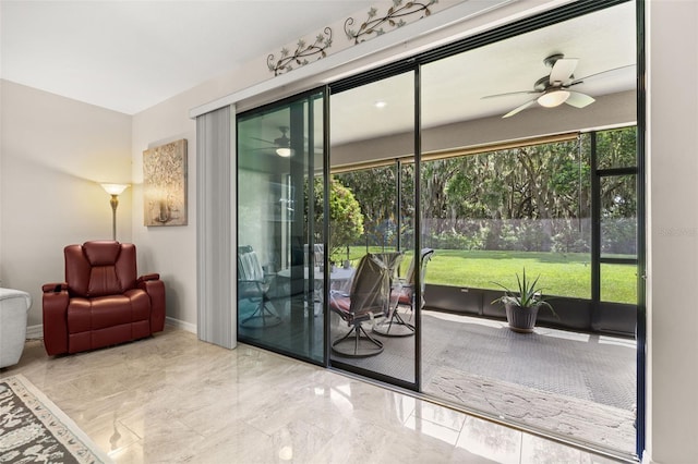 3837 Carrick Bend Dr, Kissimmee, FL 34746 - doorway to outside with ceiling fan and marble tiled flooring
