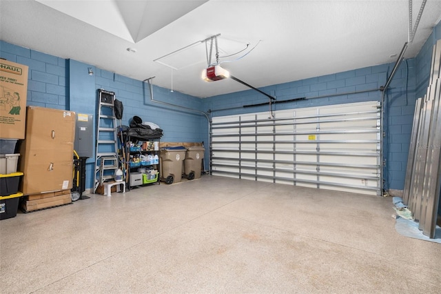 3837 Carrick Bend Dr, Kissimmee, FL 34746 - garage with a garage door opener and concrete block wall