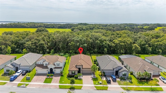 3837 Carrick Bend Dr, Kissimmee, FL 34746 - aerial perspective of suburban area with a forest