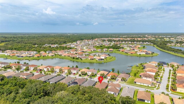 3837 Carrick Bend Dr, Kissimmee, FL 34746 - aerial overview of property's location featuring nearby suburban area and a large body of water