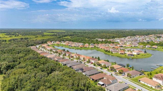 3837 Carrick Bend Dr, Kissimmee, FL 34746 - aerial view of residential area with a forest and a large body of water