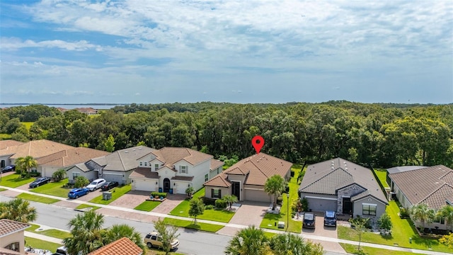 3837 Carrick Bend Dr, Kissimmee, FL 34746 - aerial perspective of suburban area with a heavily wooded area