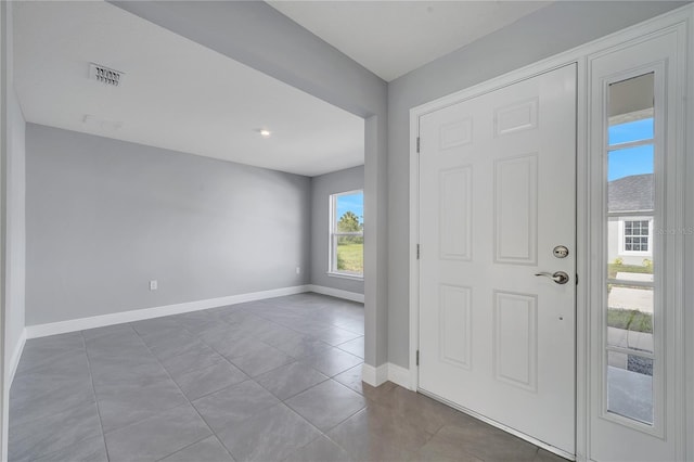 547 Viceroy Ct, Kissimmee, FL 34758 - foyer entrance with baseboards and tile patterned flooring