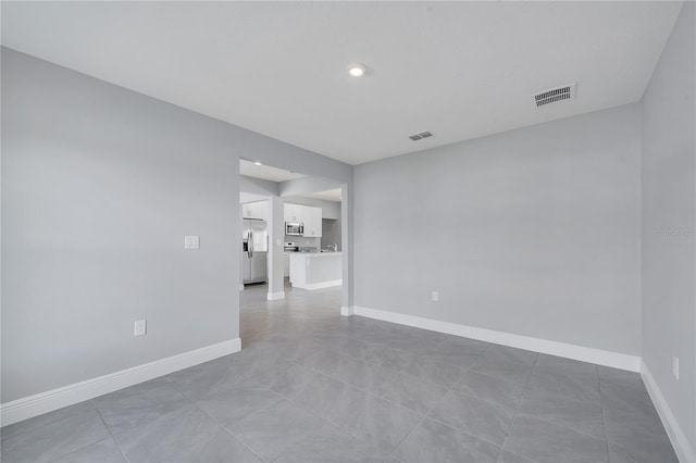547 Viceroy Ct, Kissimmee, FL 34758 - spare room with light tile patterned flooring and recessed lighting