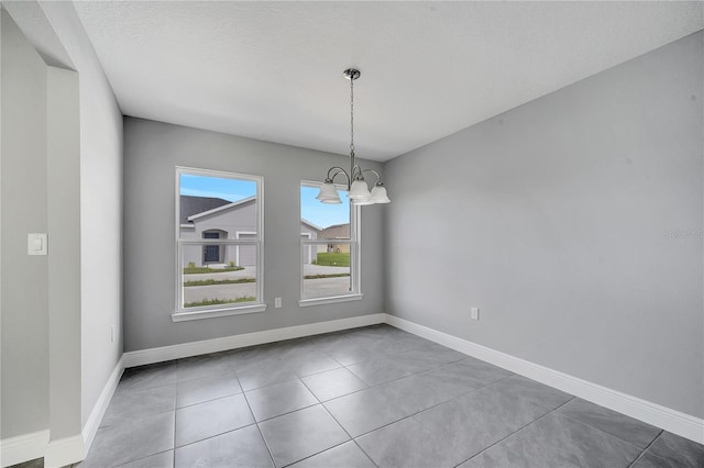 547 Viceroy Ct, Kissimmee, FL 34758 - unfurnished dining area with a chandelier and baseboards