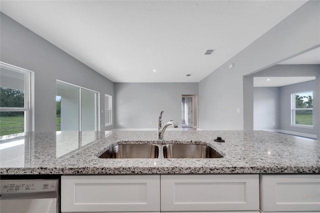 547 Viceroy Ct, Kissimmee, FL 34758 - kitchen featuring dishwasher, white cabinets, light stone counters, and recessed lighting