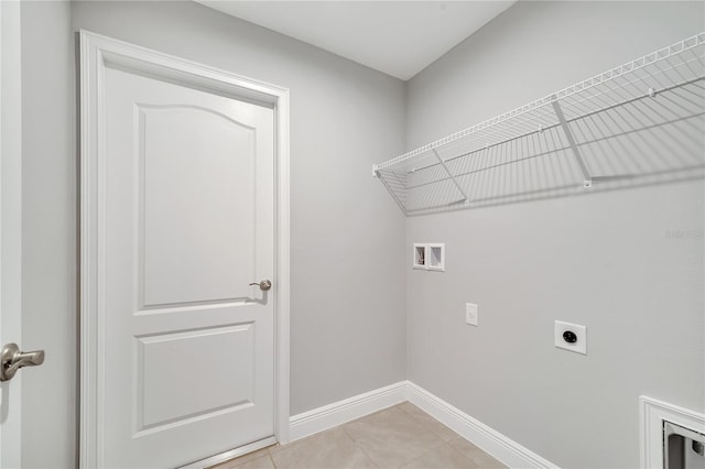 547 Viceroy Ct, Kissimmee, FL 34758 - washroom featuring electric dryer hookup, washer hookup, and light tile patterned flooring