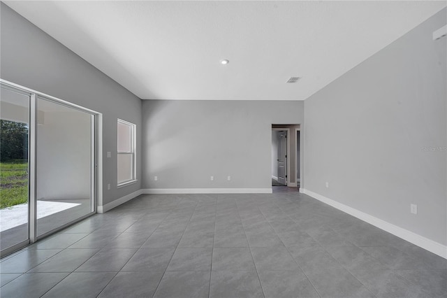 547 Viceroy Ct, Kissimmee, FL 34758 - unfurnished room featuring plenty of natural light, tile patterned floors, and recessed lighting