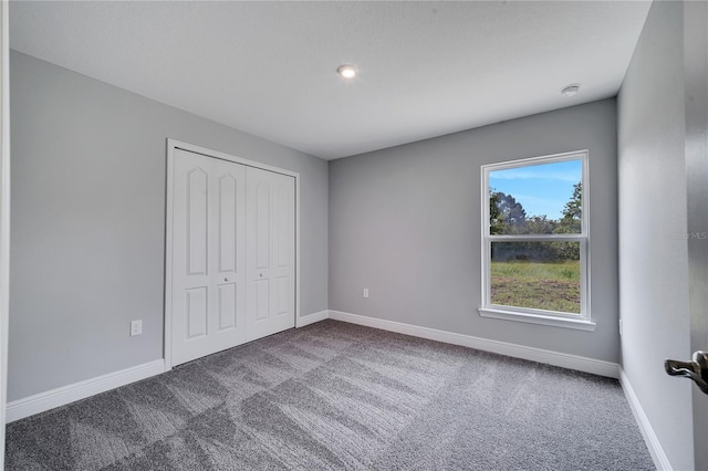 547 Viceroy Ct, Kissimmee, FL 34758 - unfurnished bedroom featuring carpet and a closet