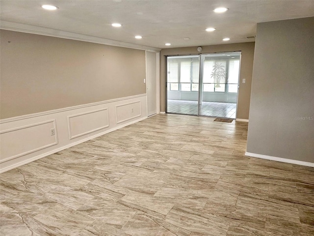 12215 Cobble Stone Dr, Hudson, FL 34667 - unfurnished room featuring crown molding, a decorative wall, and recessed lighting