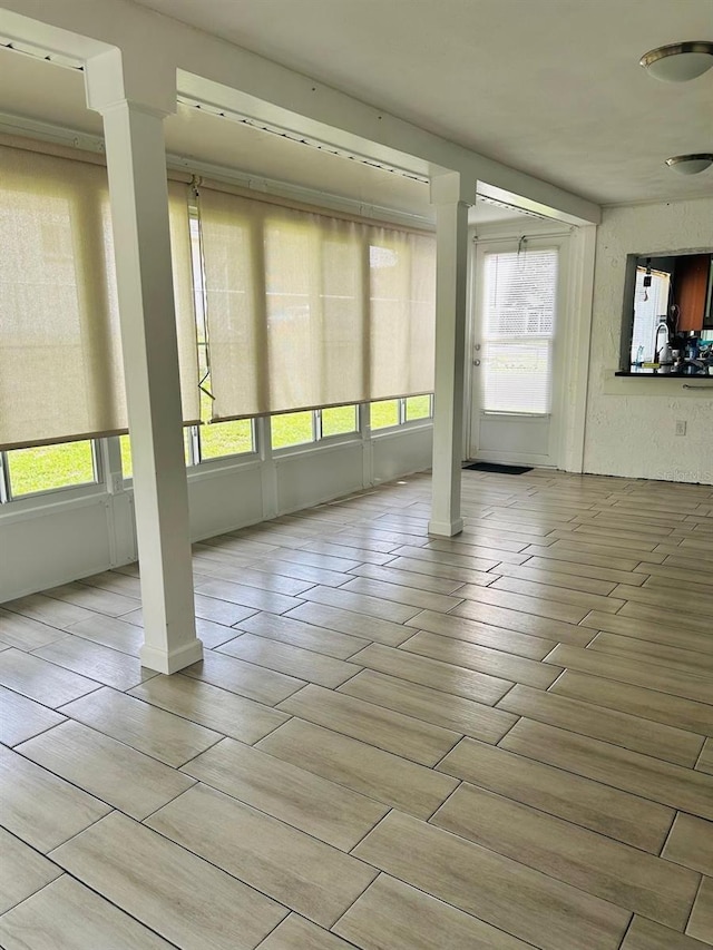 12215 Cobble Stone Dr, Hudson, FL 34667 - unfurnished sunroom featuring plenty of natural light