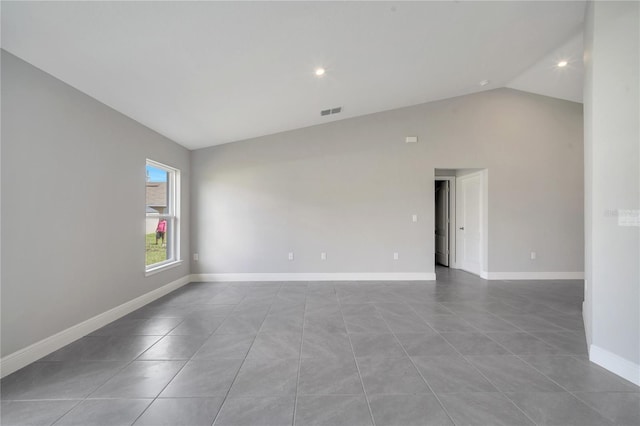 549 Viceroy Ct, Kissimmee, FL 34758 - spare room with lofted ceiling, tile patterned floors, and recessed lighting