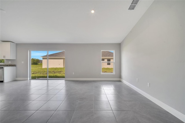 549 Viceroy Ct, Kissimmee, FL 34758 - unfurnished living room featuring tile patterned floors and baseboards