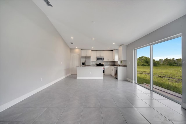 549 Viceroy Ct, Kissimmee, FL 34758 - unfurnished living room with light tile patterned floors and recessed lighting