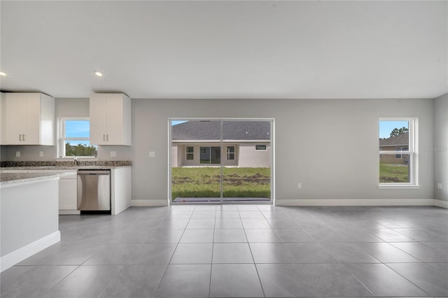 549 Viceroy Ct, Kissimmee, FL 34758 - kitchen featuring dishwasher, plenty of natural light, white cabinetry, light tile patterned floors, and recessed lighting