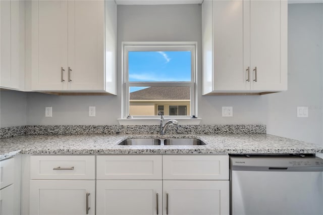 549 Viceroy Ct, Kissimmee, FL 34758 - kitchen with dishwasher, white cabinetry, and light stone countertops