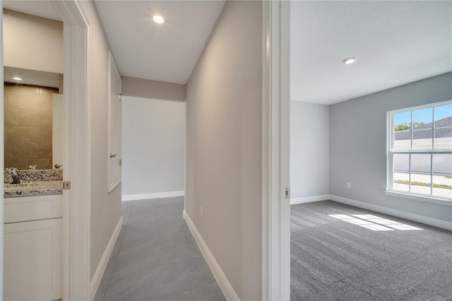 549 Viceroy Ct, Kissimmee, FL 34758 - hallway with recessed lighting and light tile patterned flooring