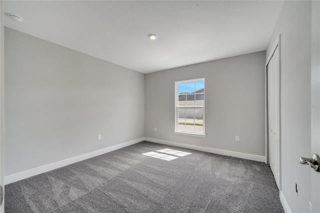 549 Viceroy Ct, Kissimmee, FL 34758 - carpeted empty room featuring baseboards and a smoke detector