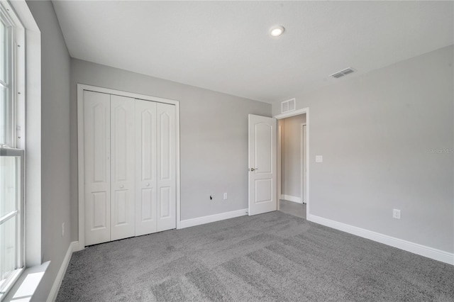 549 Viceroy Ct, Kissimmee, FL 34758 - unfurnished bedroom with carpet flooring and a closet