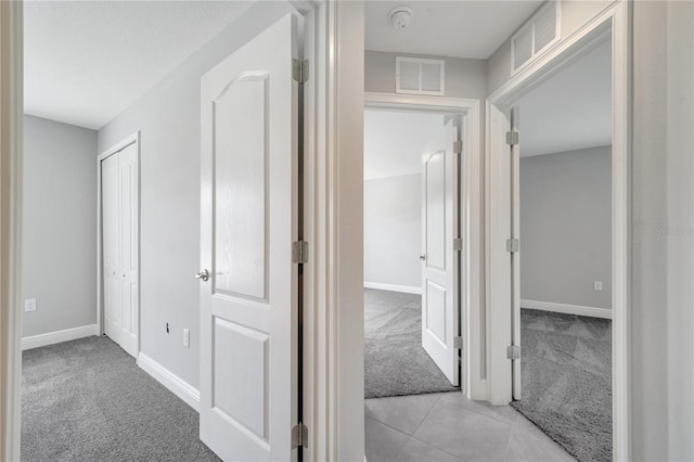 549 Viceroy Ct, Kissimmee, FL 34758 - hallway featuring light colored carpet and baseboards