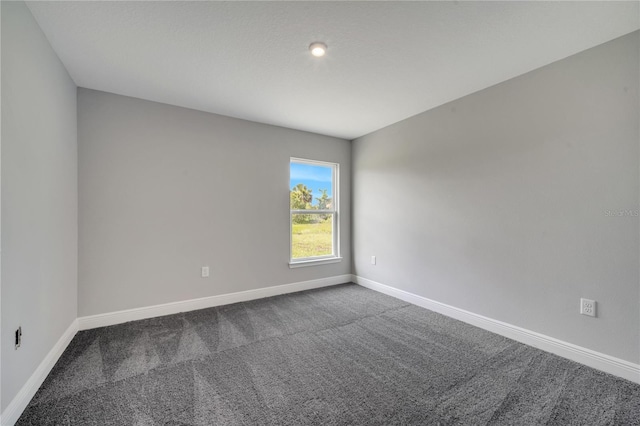 549 Viceroy Ct, Kissimmee, FL 34758 - spare room with dark carpet and baseboards