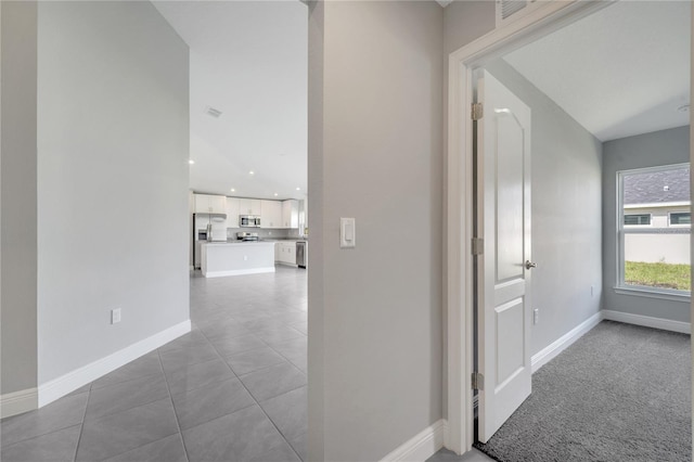 549 Viceroy Ct, Kissimmee, FL 34758 - hallway with baseboards and tile patterned flooring