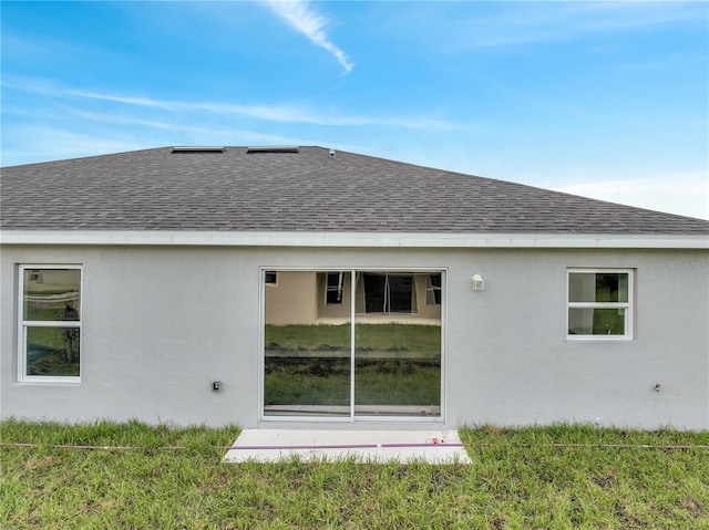 549 Viceroy Ct, Kissimmee, FL 34758 - rear view of house featuring roof with shingles and stucco siding