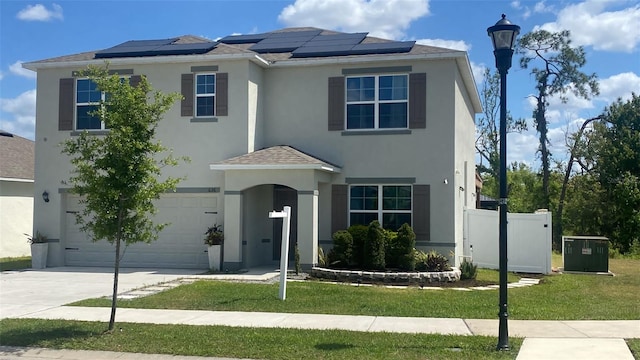 636 Autumn Stream Drive St, Auburndale, FL 33823 - view of front of property featuring a garage, stucco siding, roof mounted solar panels, and driveway