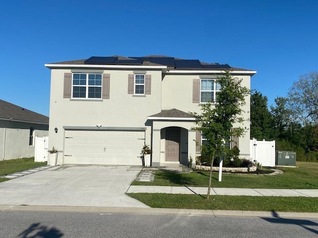 636 Autumn Stream Drive St, Auburndale, FL 33823 - traditional-style home featuring stucco siding, a garage, concrete driveway, and solar panels