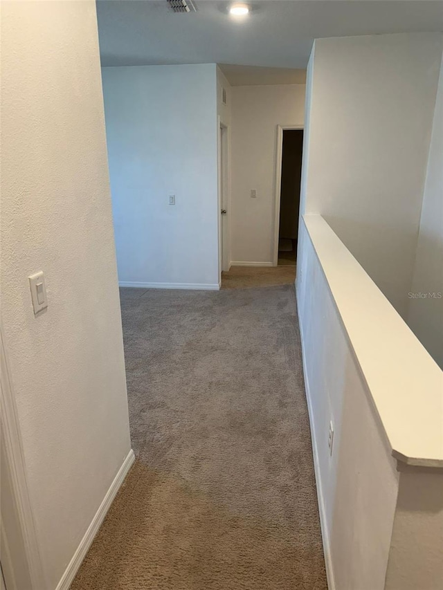636 Autumn Stream Drive St, Auburndale, FL 33823 - corridor with light colored carpet and baseboards