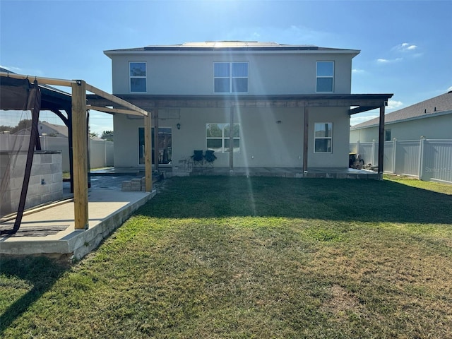 636 Autumn Stream Drive St, Auburndale, FL 33823 - back of property featuring a patio, a fenced backyard, and stucco siding