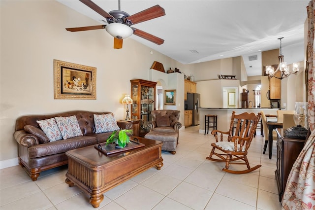 1525 Gants Cir, Kissimmee, FL 34744 - living room featuring light tile patterned floors, a chandelier, ceiling fan, and high vaulted ceiling