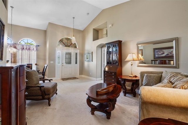 1525 Gants Cir, Kissimmee, FL 34744 - living room with high vaulted ceiling, light carpet, and light tile patterned floors