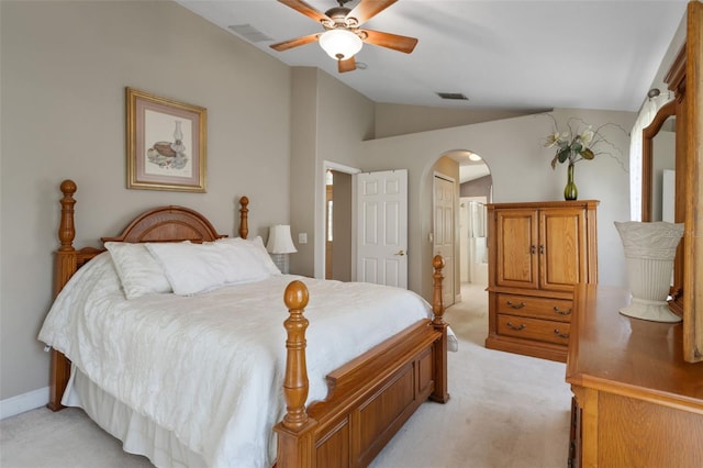 1525 Gants Cir, Kissimmee, FL 34744 - bedroom featuring light carpet, vaulted ceiling, arched walkways, ceiling fan, and a closet