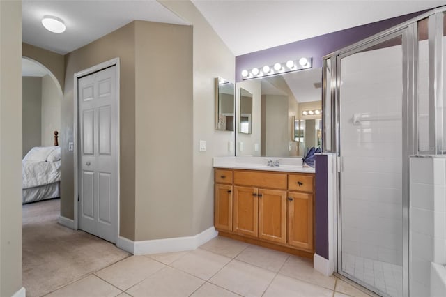 1525 Gants Cir, Kissimmee, FL 34744 - full bath featuring vanity, tile patterned flooring, a stall shower, and ensuite bath