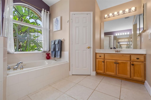 1525 Gants Cir, Kissimmee, FL 34744 - full bathroom with vanity, a garden tub, and tile patterned flooring