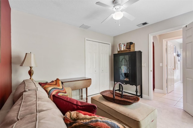 1525 Gants Cir, Kissimmee, FL 34744 - tiled living room featuring ceiling fan and carpet flooring