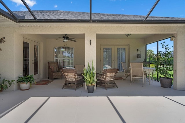1525 Gants Cir, Kissimmee, FL 34744 - view of patio with french doors, a ceiling fan, outdoor dining space, and glass enclosure