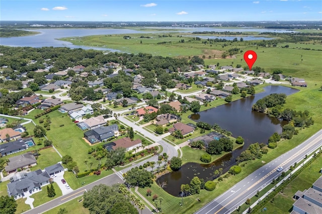 1525 Gants Cir, Kissimmee, FL 34744 - aerial view of property and surrounding area featuring a large body of water and nearby suburban area