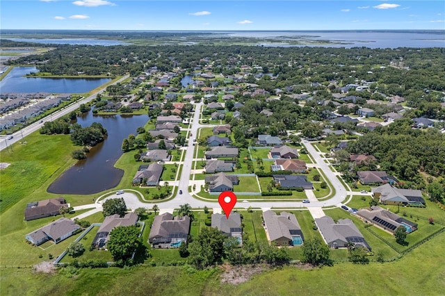 1525 Gants Cir, Kissimmee, FL 34744 - aerial view of property and surrounding area featuring a large body of water and nearby suburban area