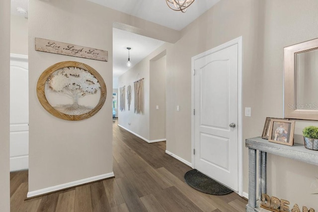 1864 Castleton Dr, Saint Cloud, FL 34771 - entryway featuring dark wood-type flooring and baseboards