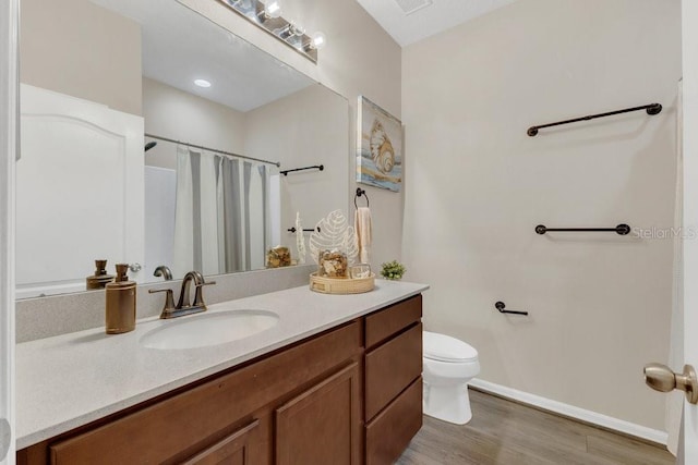 1864 Castleton Dr, Saint Cloud, FL 34771 - bathroom featuring vanity, wood finished floors, and a shower with shower curtain