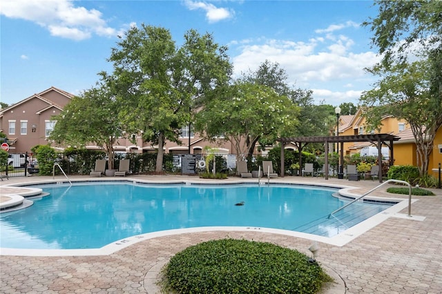 8836 Villa View Cir Unit 303, Orlando, FL 32821 - community pool with a pergola and a patio