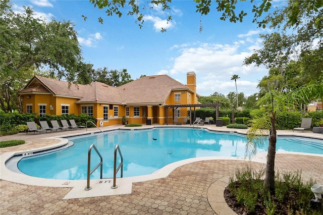 8836 Villa View Cir Unit 303, Orlando, FL 32821 - community pool with a patio and a pergola