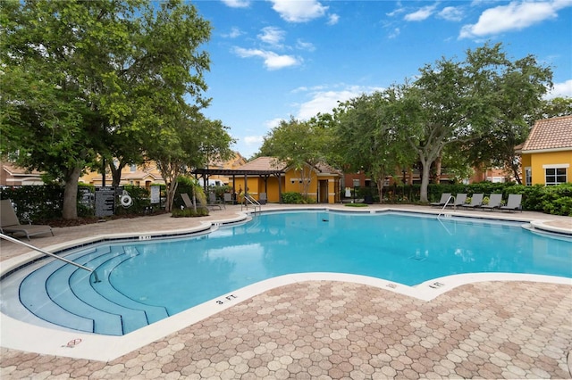 8836 Villa View Cir Unit 303, Orlando, FL 32821 - community pool featuring a patio