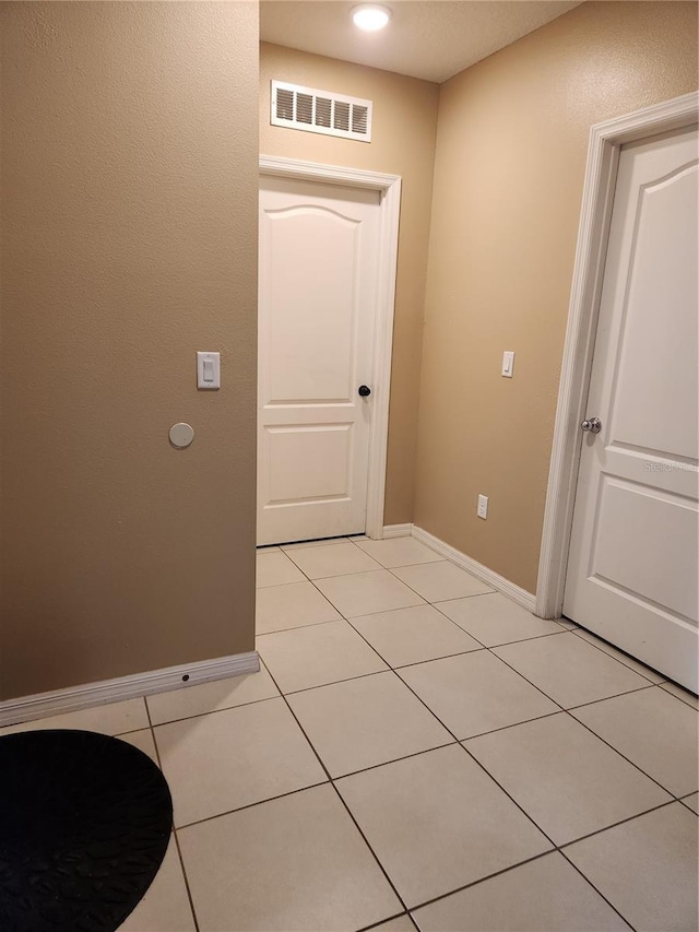 144 Hawthorne Way, Davenport, FL 33896 - corridor featuring baseboards and light tile patterned floors